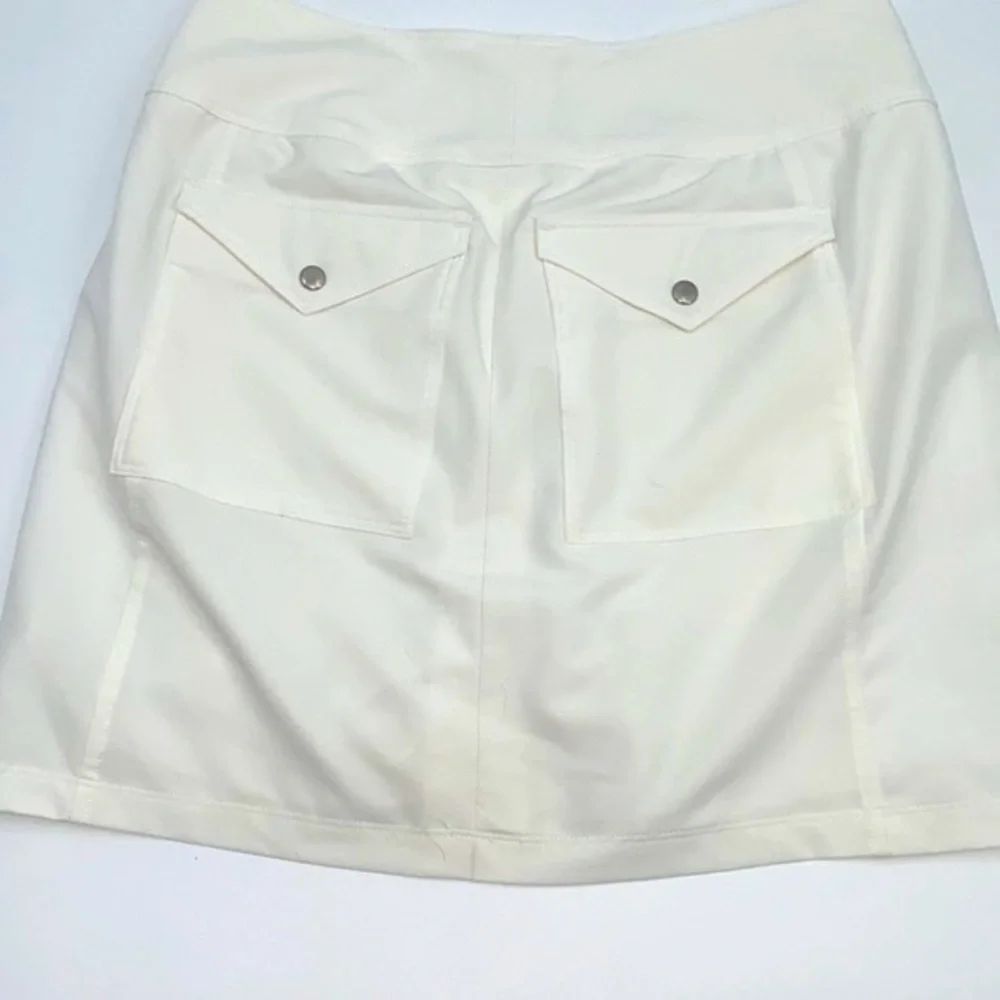 UEC Jofit essential golf skort white size “2” equivalent small tag cut out
